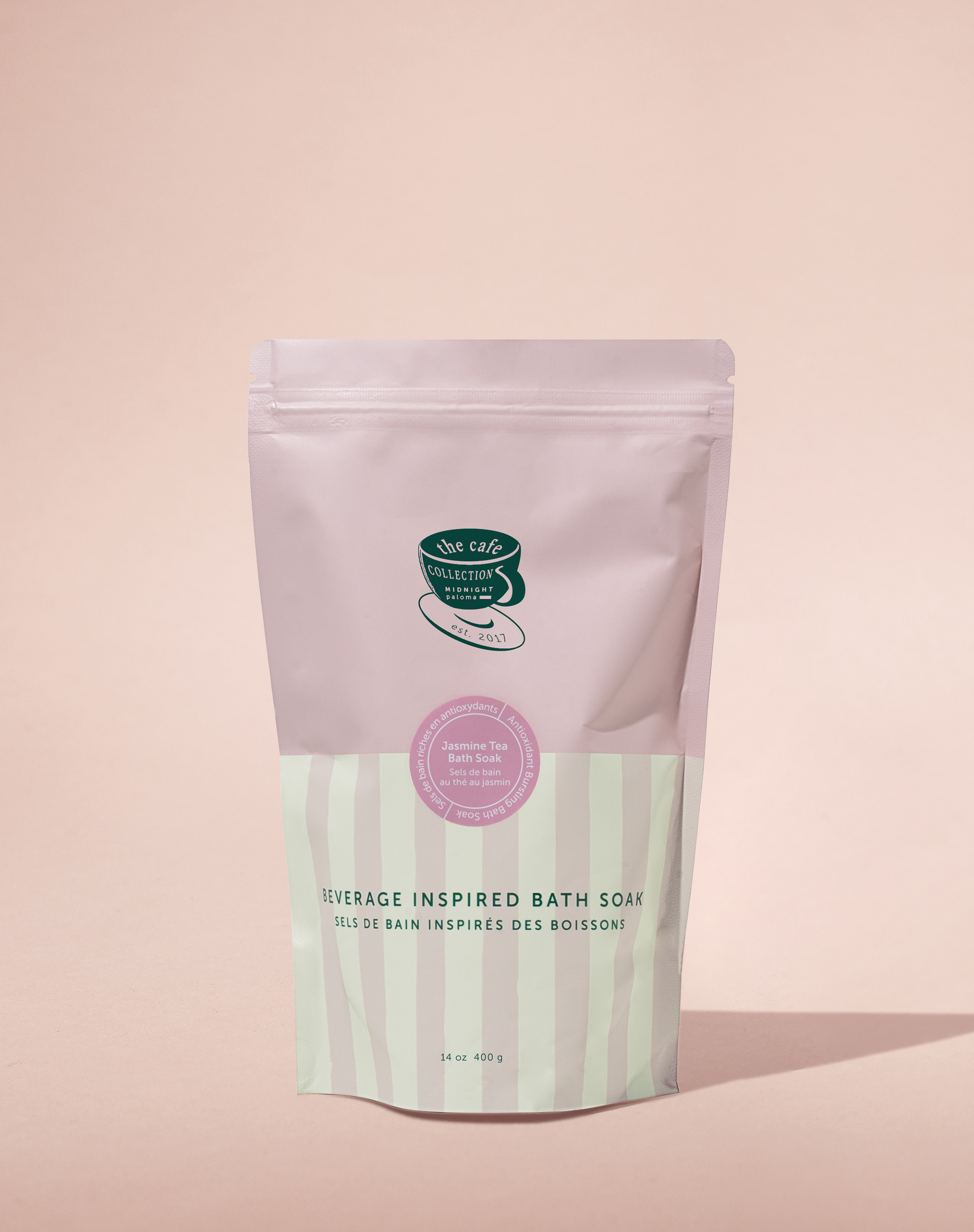Danielle Gracioso Graphic Designer Vancouver BC Canada – Front view of the 14 oz Jasmine Tea Bath Soak pouch on a soft blush background. Designed by Danielle Gracioso as part of the Café Collection.